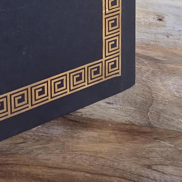 A square board corner under a gold key border